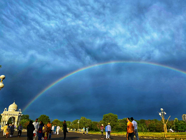 A vibrant community gathering under a bright sky, symbolizing unity and hope.