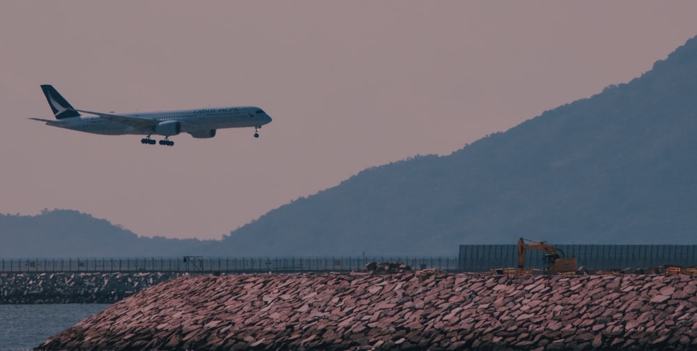 an airplane flying over a body of water