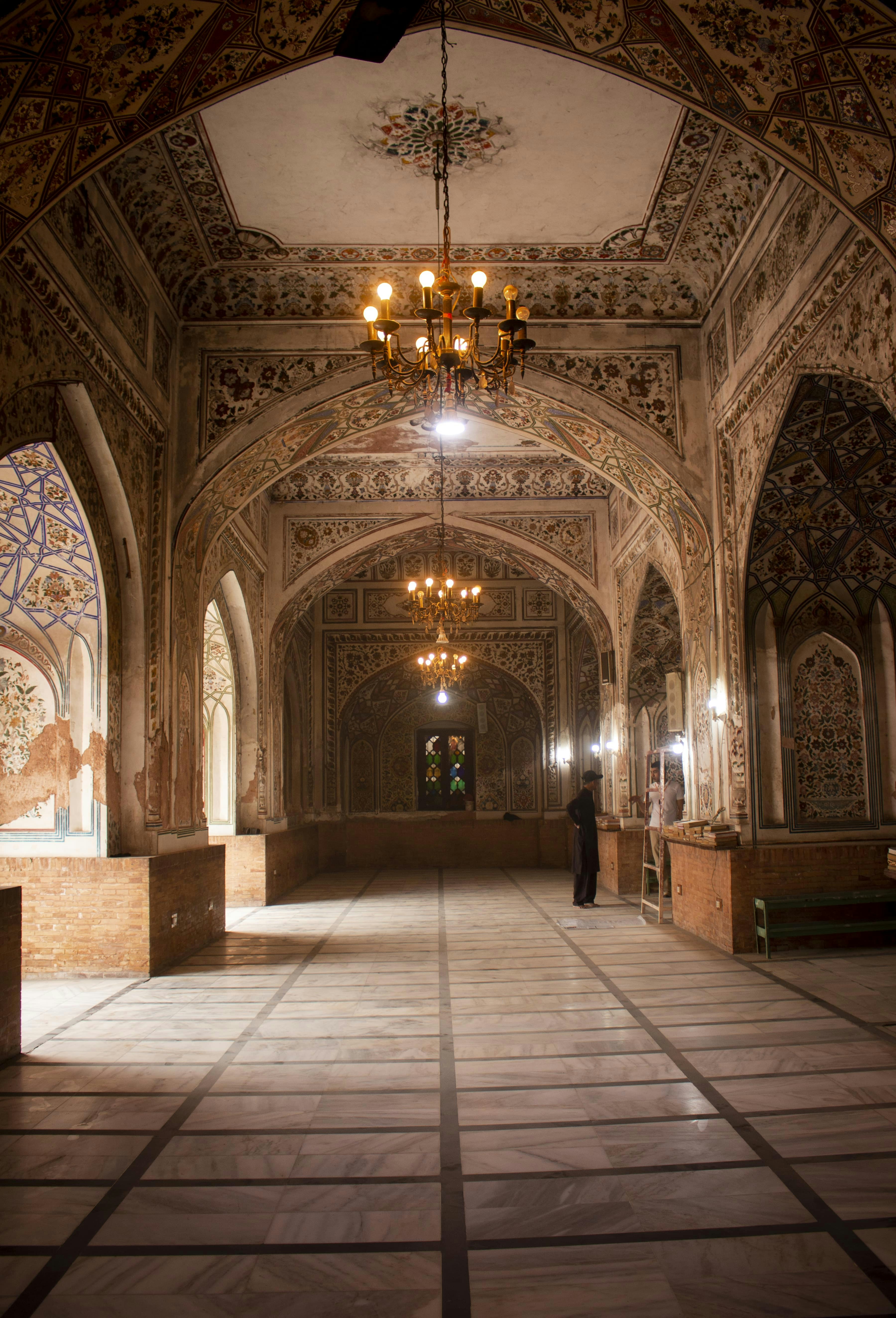a large room with a chandelier hanging from the ceiling
