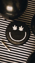 a black cake with a smiley face on it