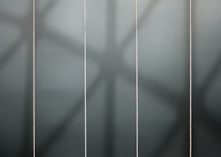 Three vertical columns showing pricing plans with dark sophisticated background.