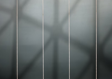 Three vertical columns showing pricing plans with dark sophisticated background.