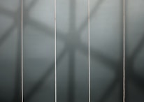 Cinematic storyboard panels illustrating a brand's visual journey in a dark, glass-inspired setting.