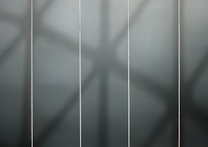 Grid display of various product containers with subtle shadows enhancing the premium feel