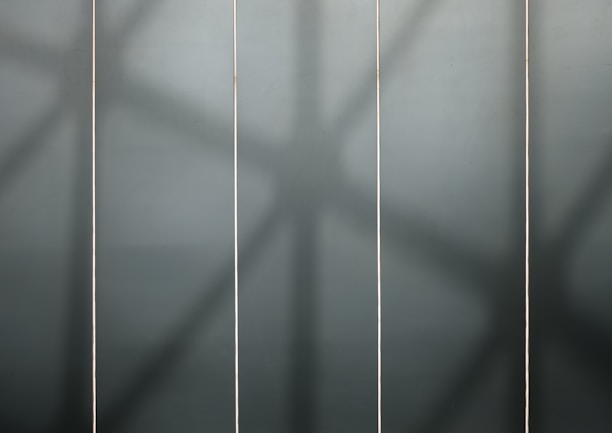 A sleek industrial-style grid layout showing three large images stacked above bold headings and short descriptions.