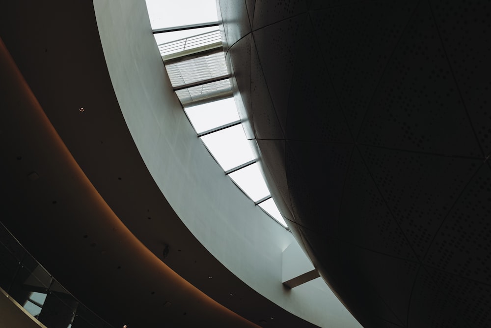 a large circular window in a building with a skylight