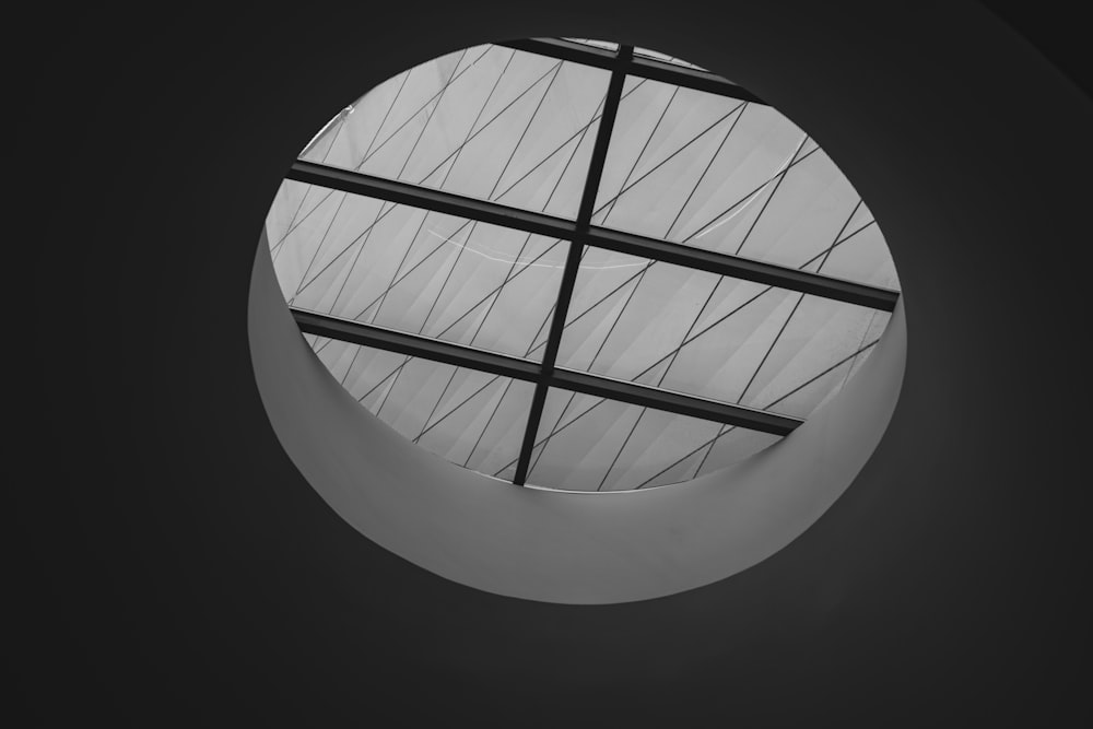 a black and white photo of a circular window
