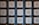 Several large white cubes with black Chinese characters are arranged in vertical columns against a blue background.