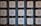 Several large white cubes with black Chinese characters are arranged in vertical columns against a blue background.