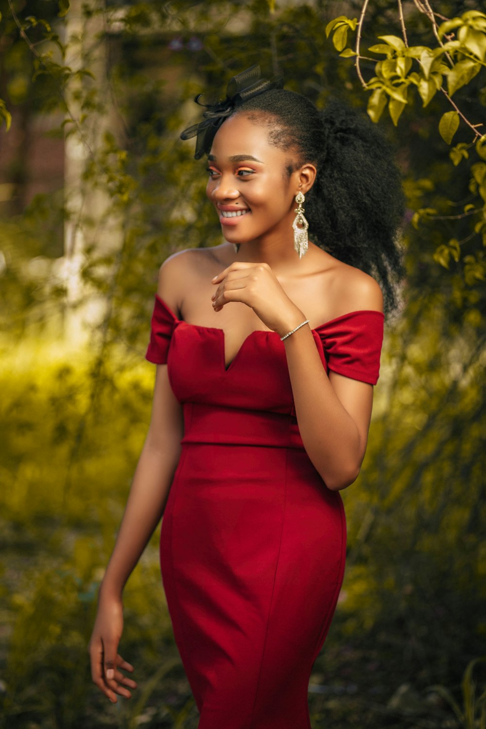 a woman in a red dress posing for a picture