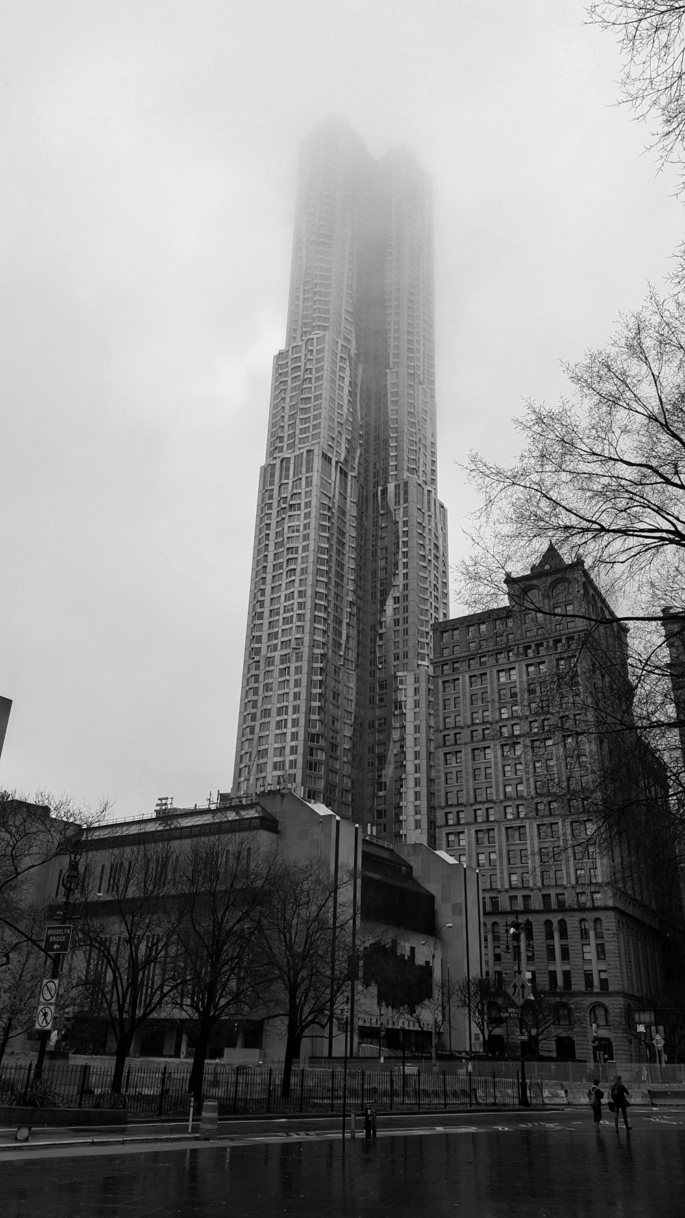 a very tall building towering over a city