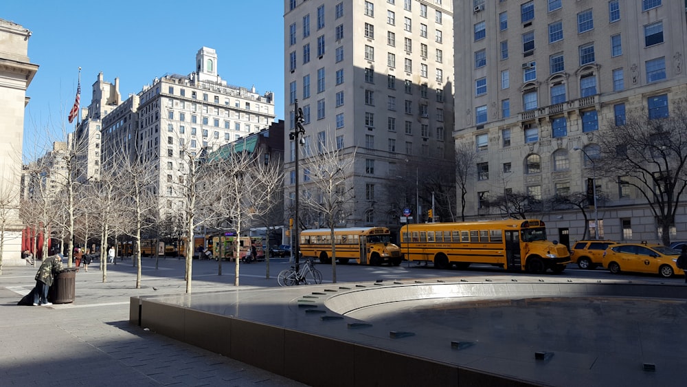 a couple of yellow school buses parked next to each other