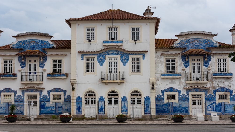 a large white and blue building with lots of windows