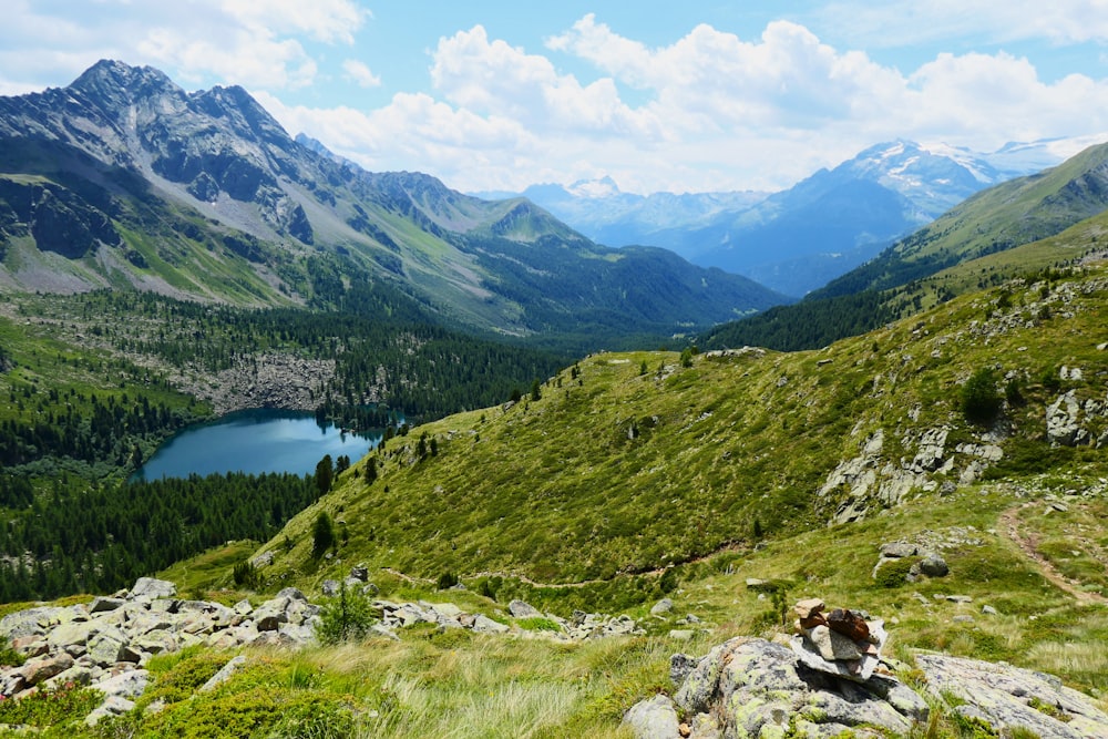 a view of a mountain range with a lake in the distance