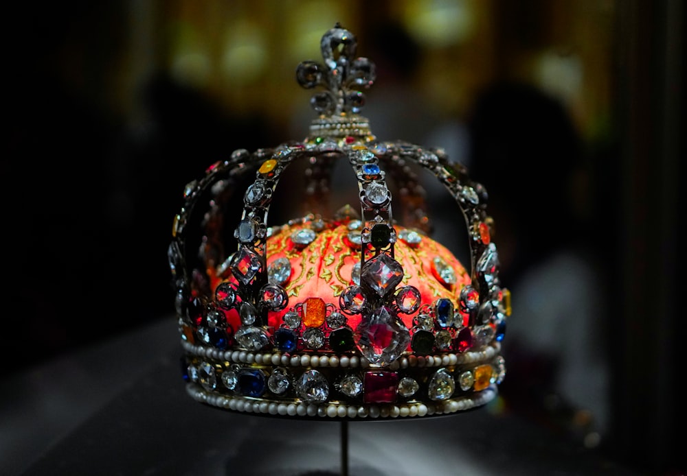 a crown is sitting on a stand on a table