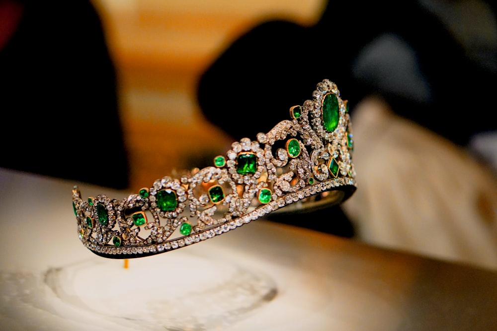 a tiara on a table with a person in the background