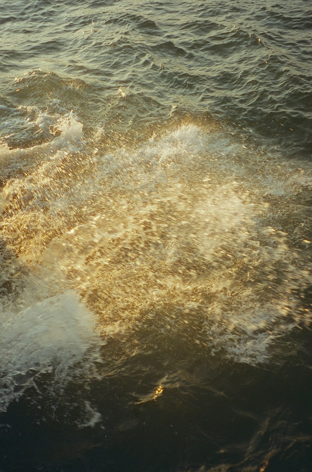 a person riding a surfboard on top of a body of water