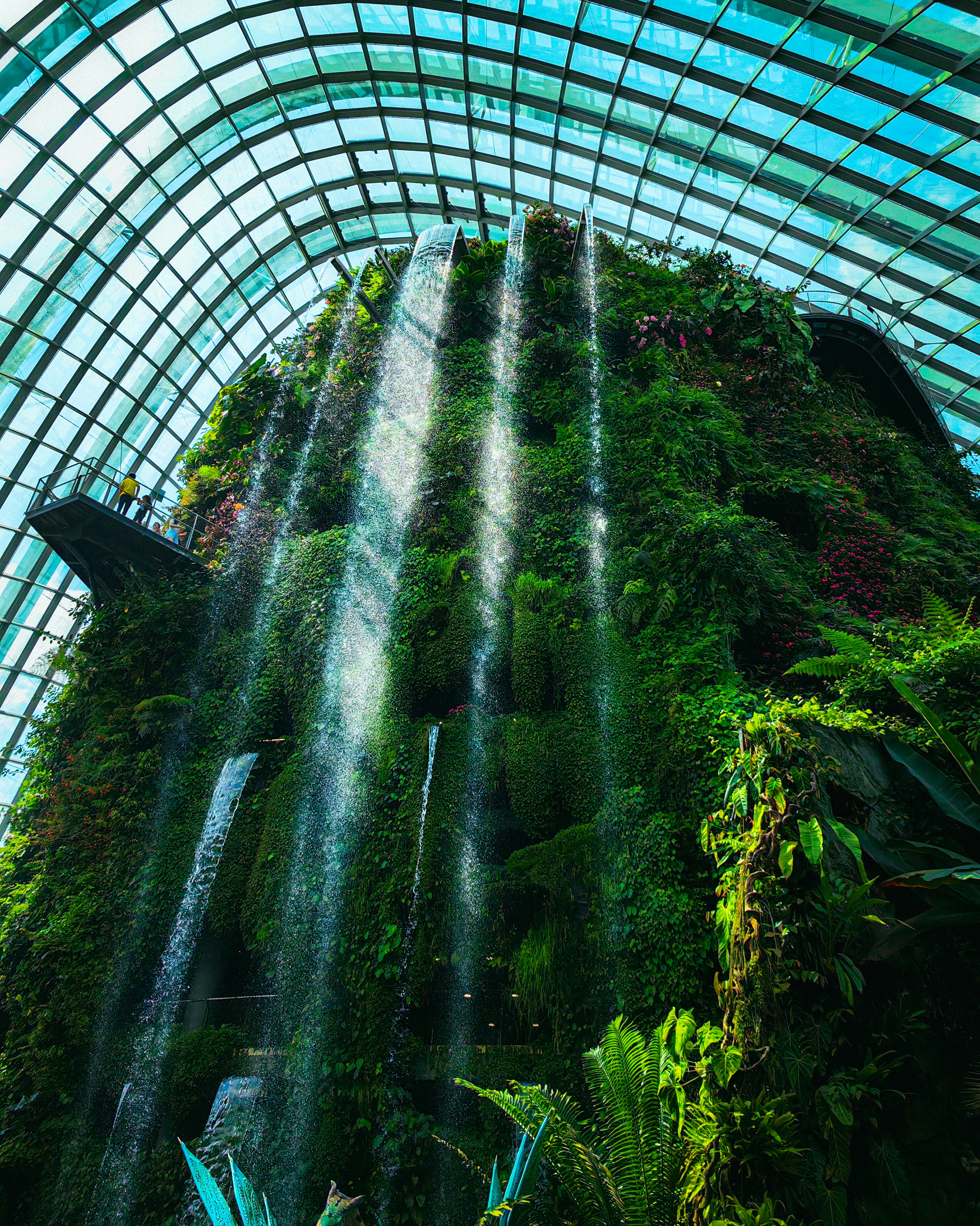 the inside of a building with a waterfall