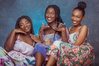 Illustration of diverse women connecting and supporting each other in a warm, soft-colored setting.