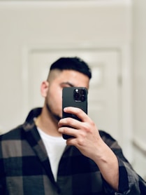 a man taking a picture of himself in a mirror