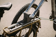 A bike being carefully loaded onto a transport vehicle.