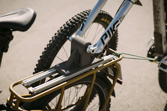 Close-up of a bike securely strapped inside a transportation vehicle.