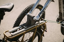 Close-up shot of a bicycle booster securely attached to a bike frame during a test ride.