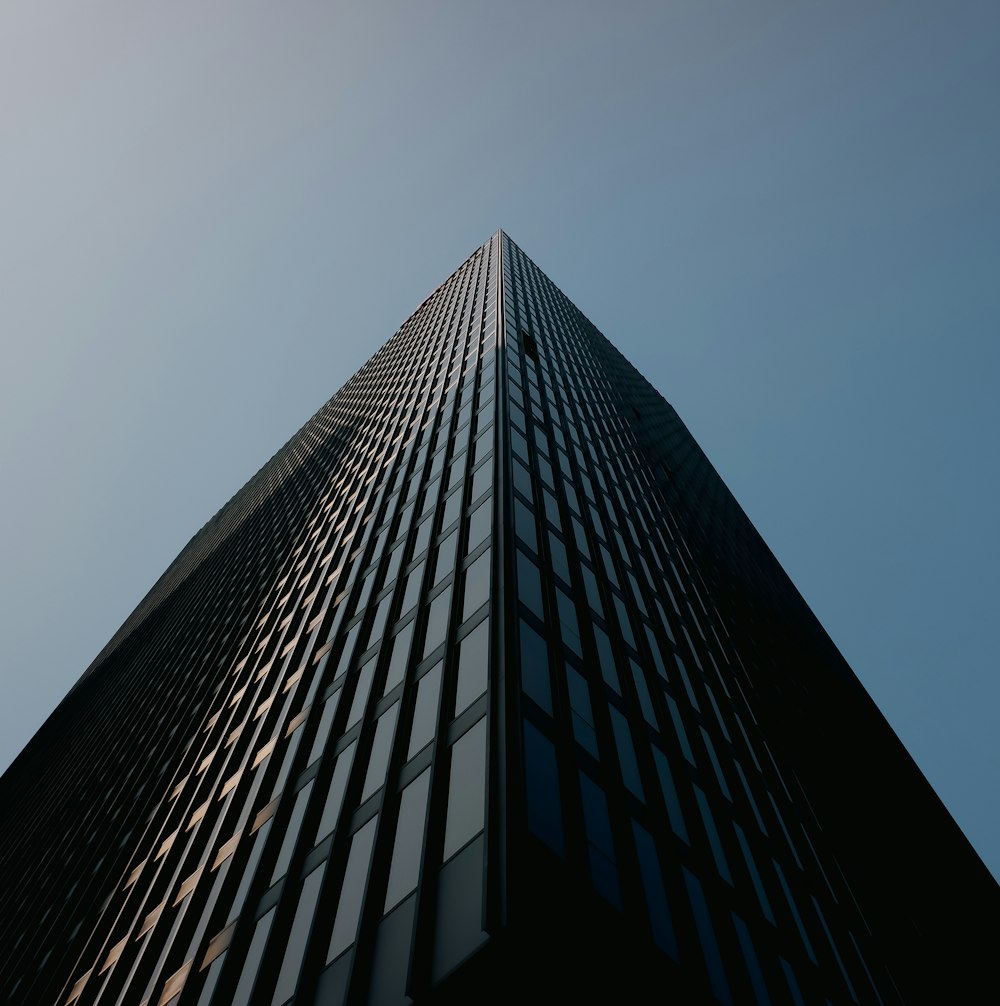 a very tall building with a sky background