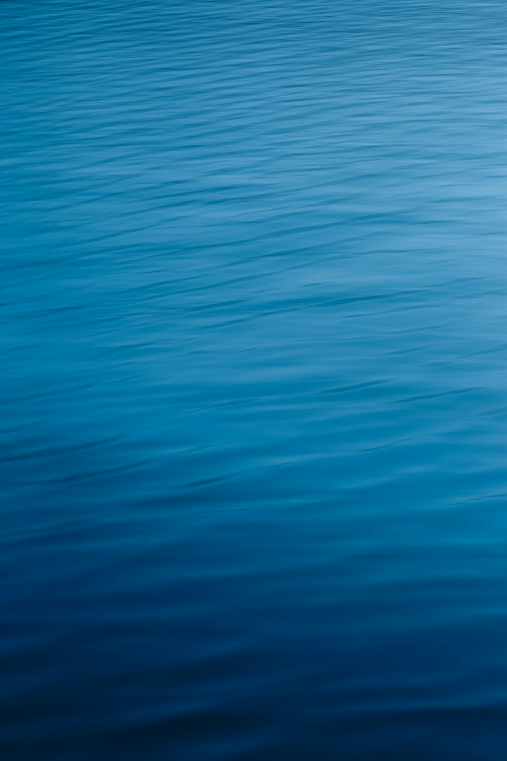 a boat floating on top of a large body of water