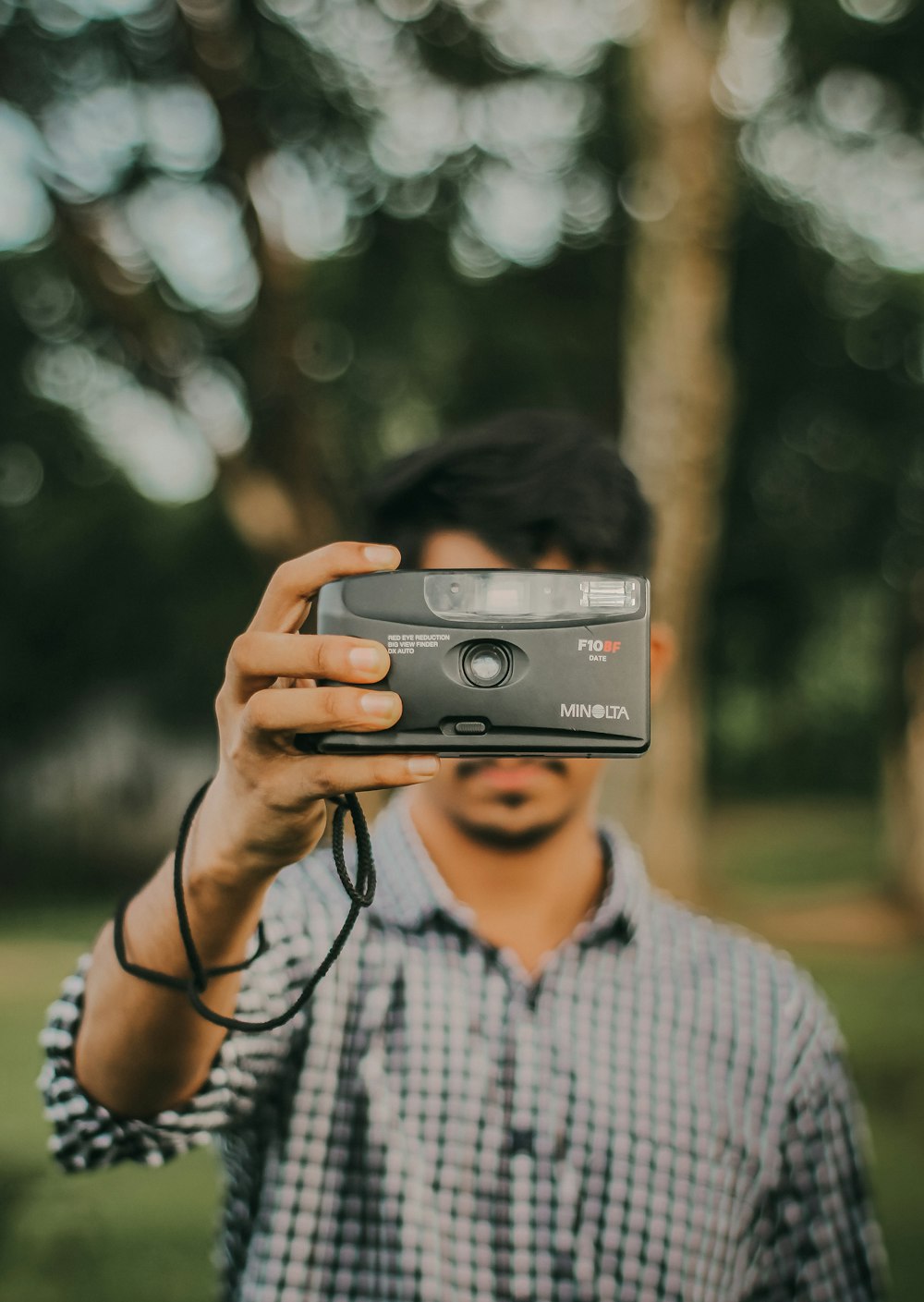 a man taking a picture of himself with a camera