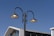 A close-up of a modern LED lamp installed on a street pole during the day.