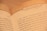 A close-up of an open book displaying text with the heading 'JESUS CALLING'. The text appears to be a religious or spiritual message, with focus on phrases like 'I AM YOUR FATHER-GOD' and discussion of devotion and spiritual duties.