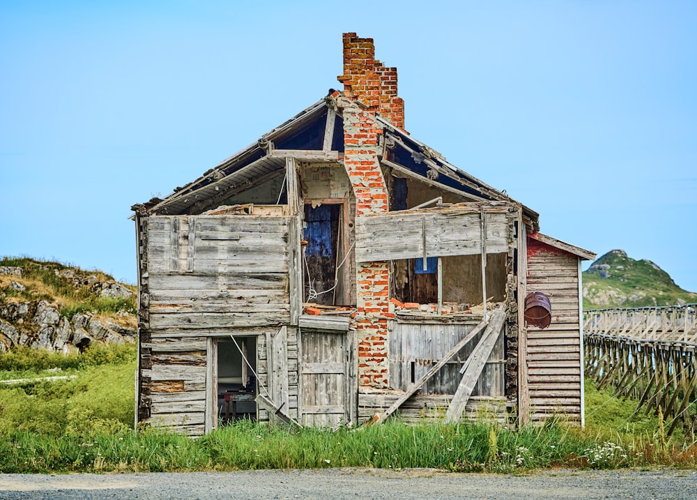 an old run down house with a broken window