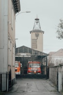 a red and white truck parked in front of a building