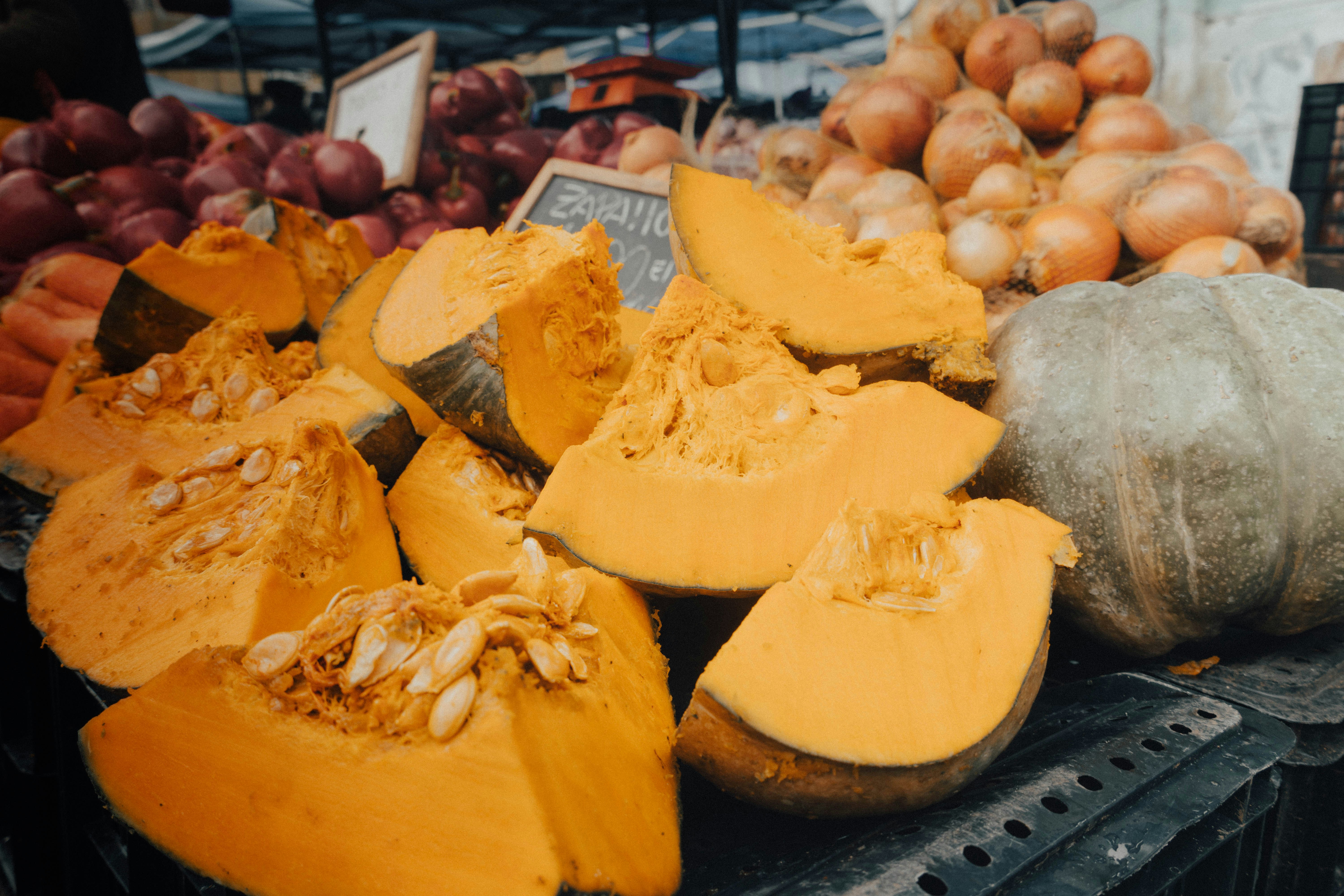 a pile of pumpkins sitting on top of a table