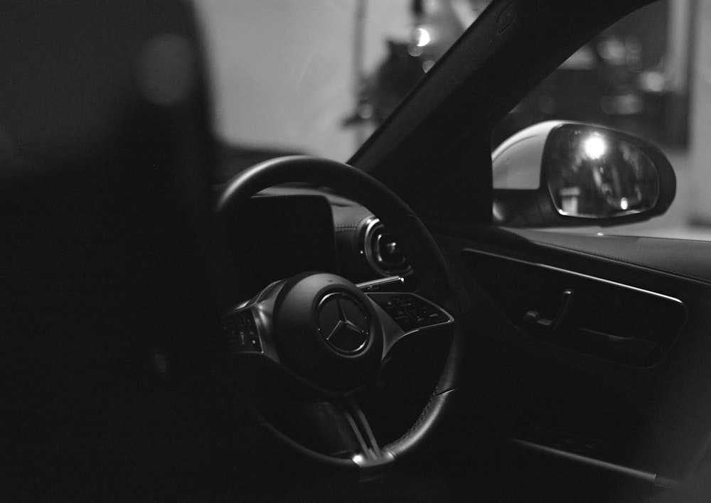 a black and white photo of a car dashboard