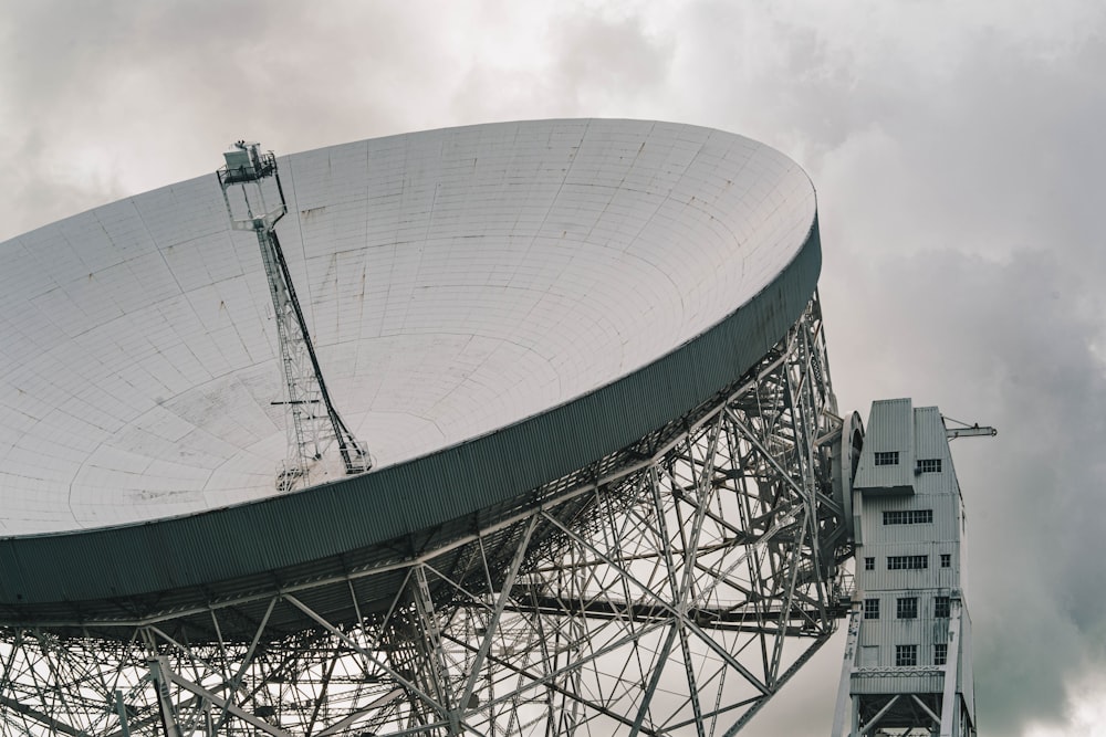 a large satellite dish sitting on top of a metal structure