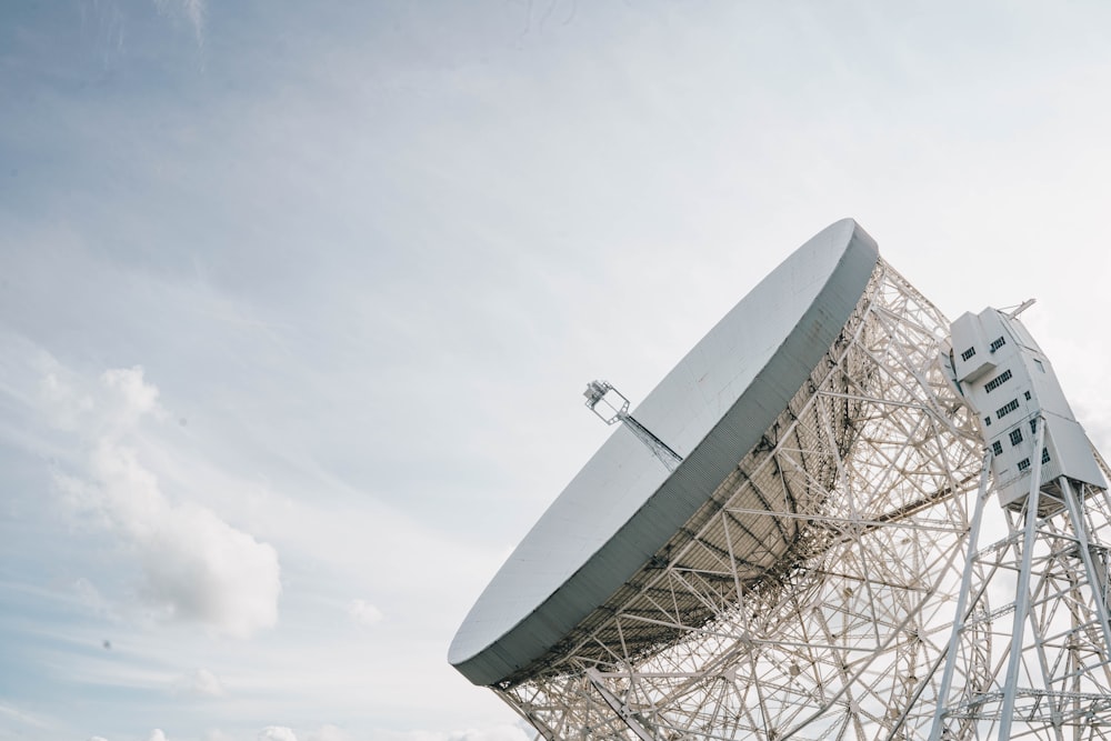 a large satellite dish sitting on top of a metal structure