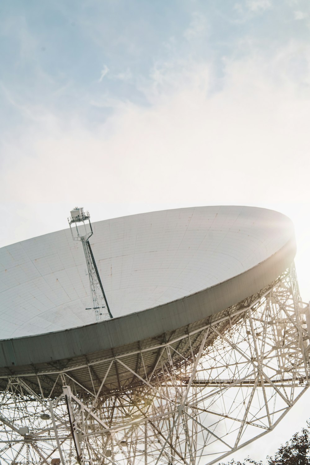 a large satellite dish sitting on top of a metal structure