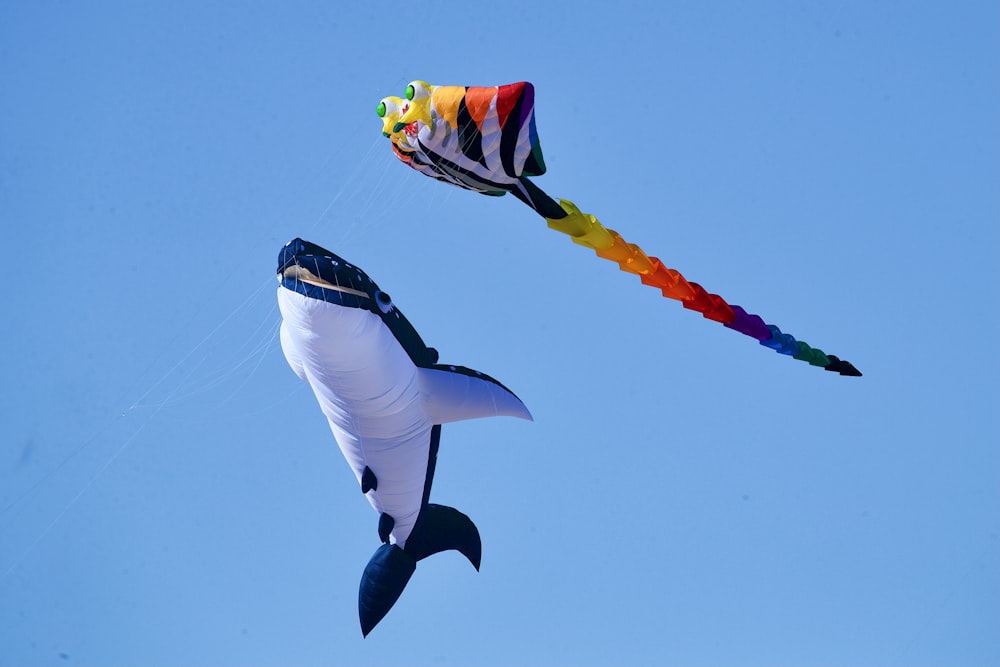 a kite shaped like a shark flying in the sky