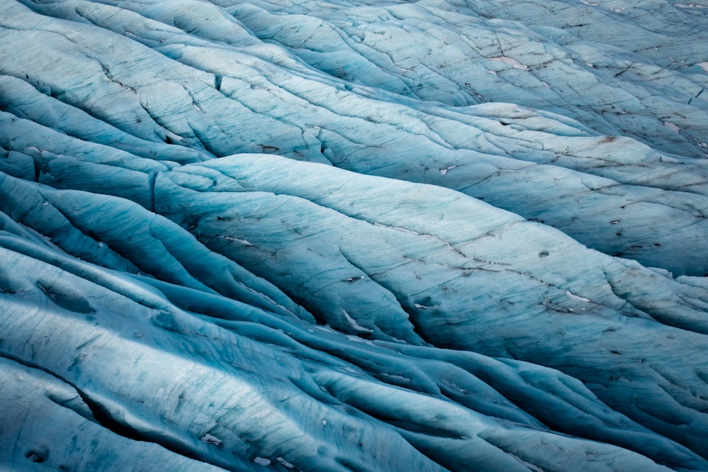 a very large blue glacier that is very close to the ground