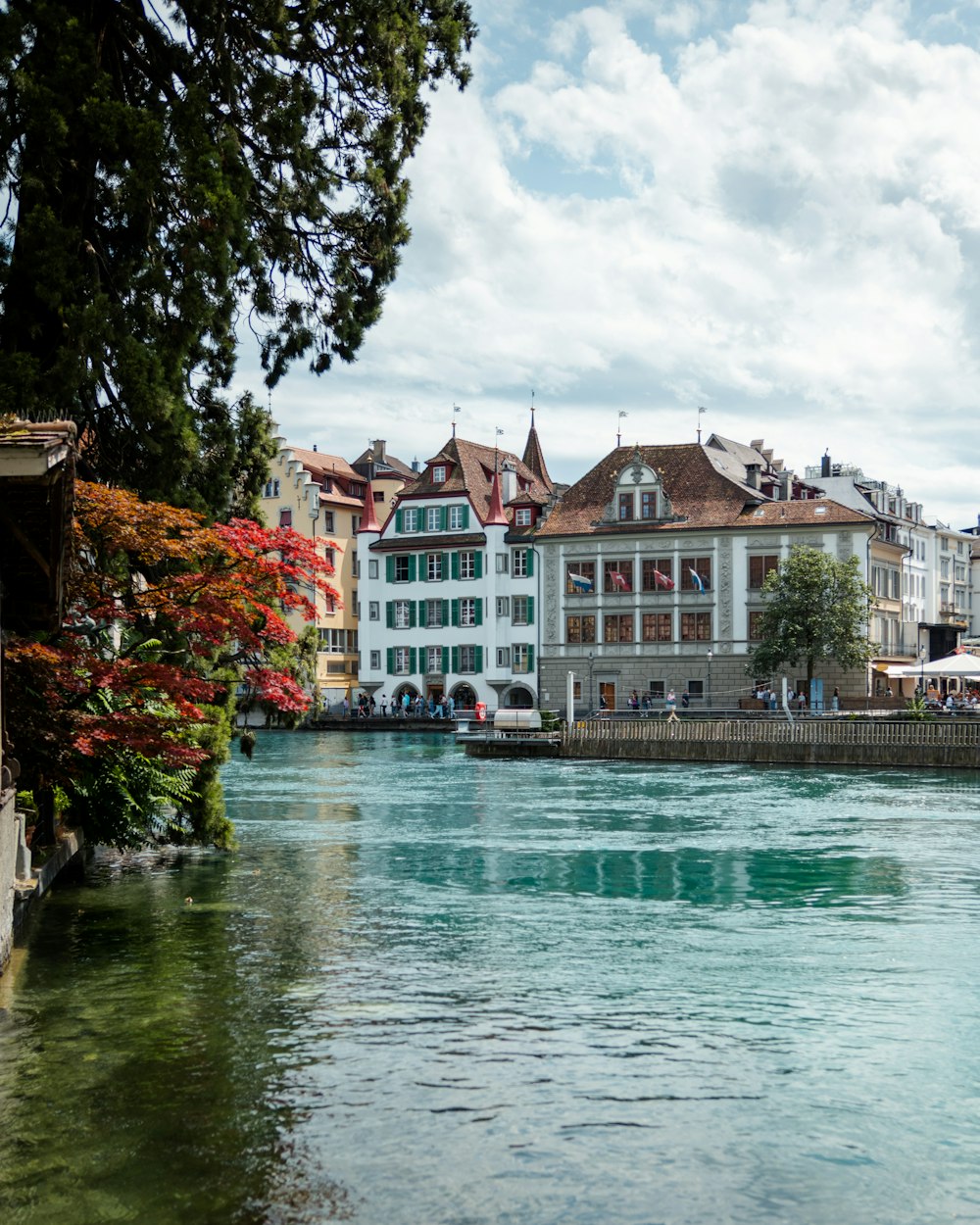 a river running through a city next to tall buildings