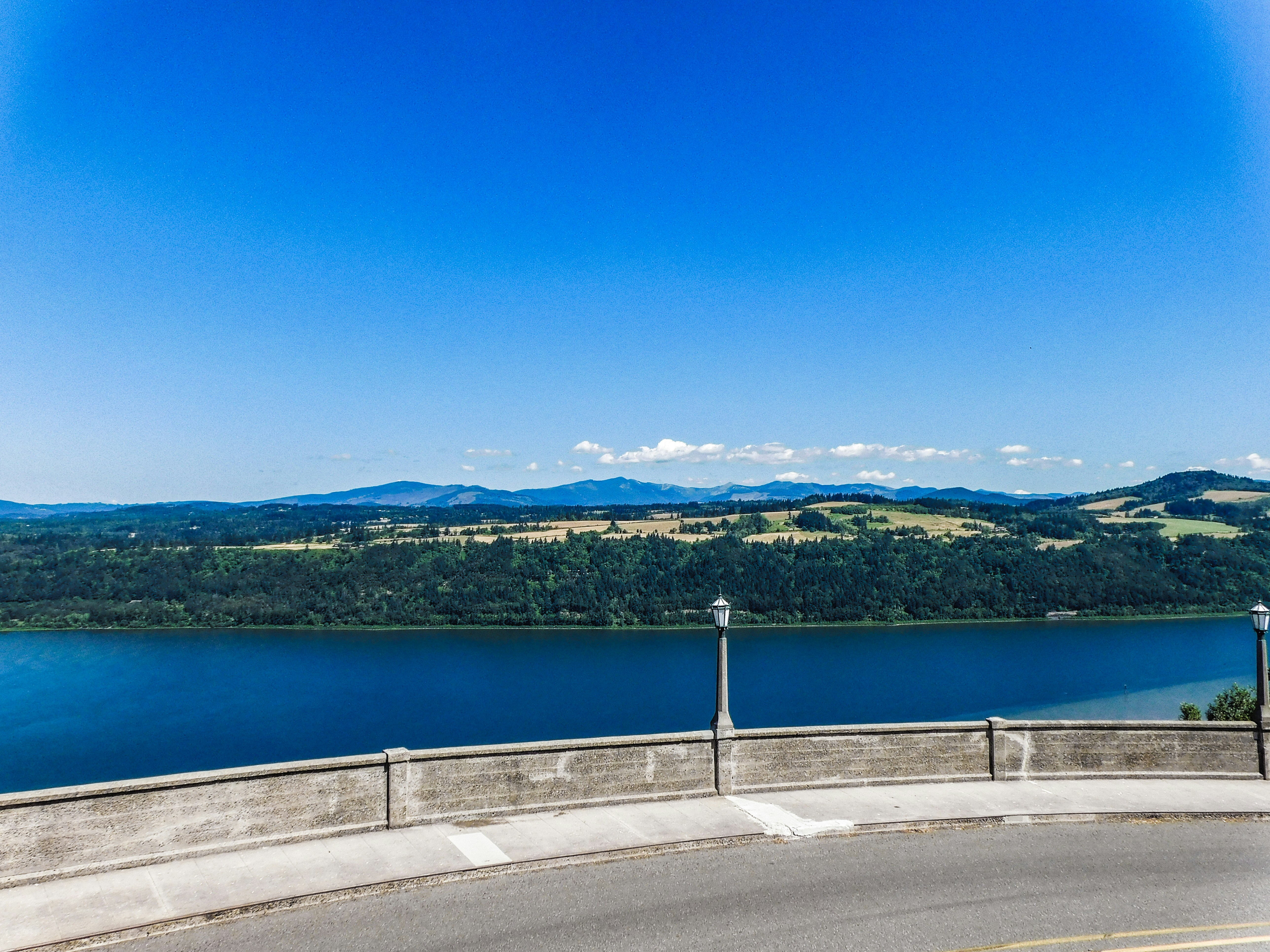 a view of a large body of water from a bridge, 