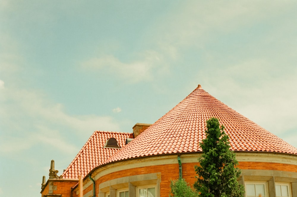 a red brick building with a red tiled roof