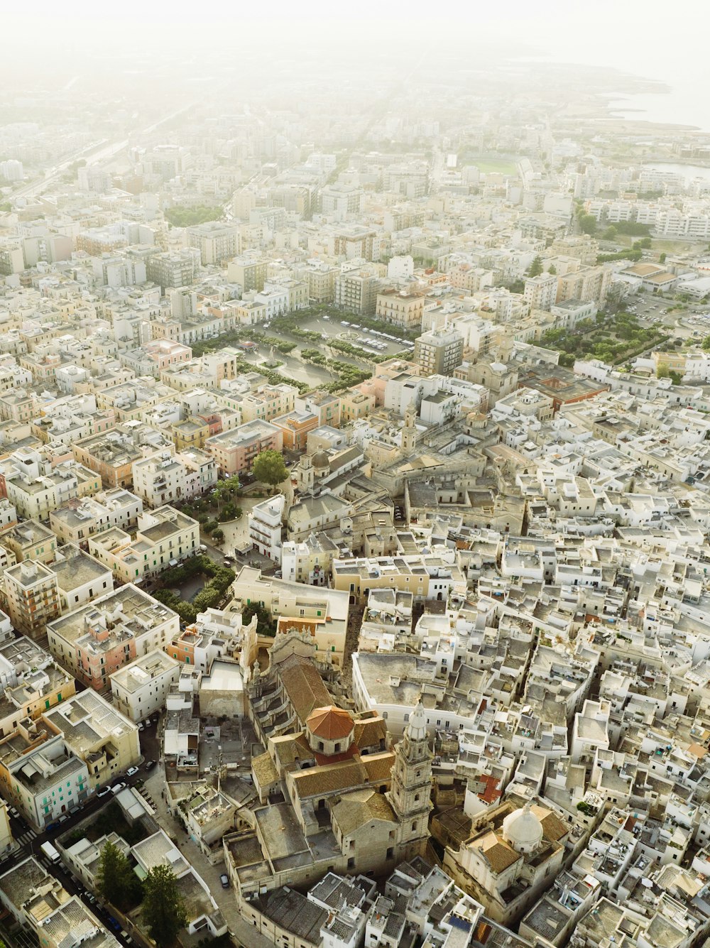 an aerial view of a city with lots of tall buildings