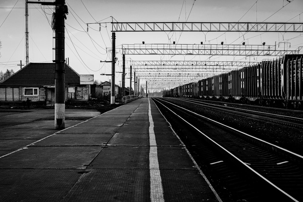 a black and white photo of a train station