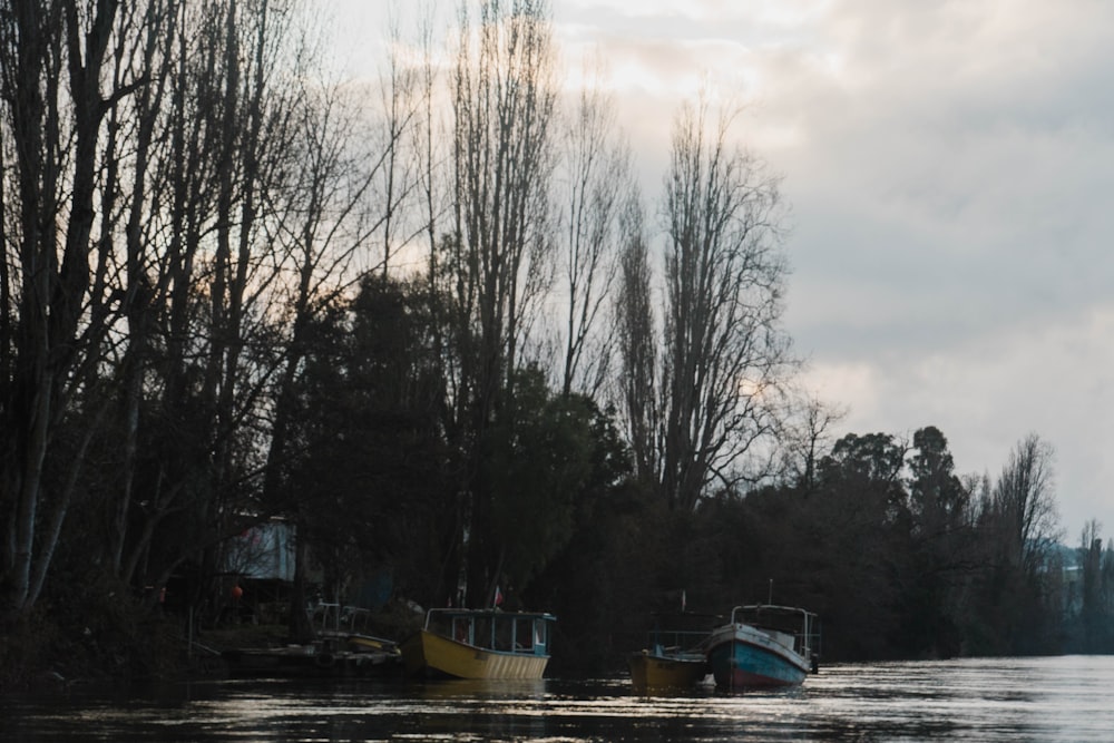 a couple of boats that are sitting in the water