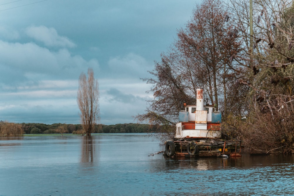 a boat sitting on top of a body of water