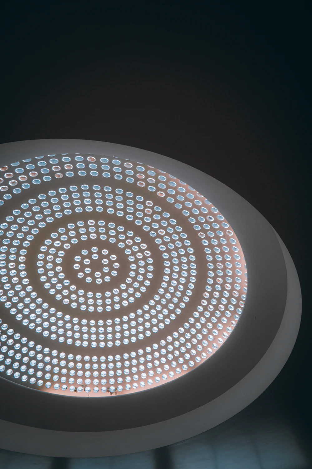 Circular light fixture in a dark room