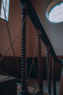 Elegant wooden stair railing with decorative balusters in a home.